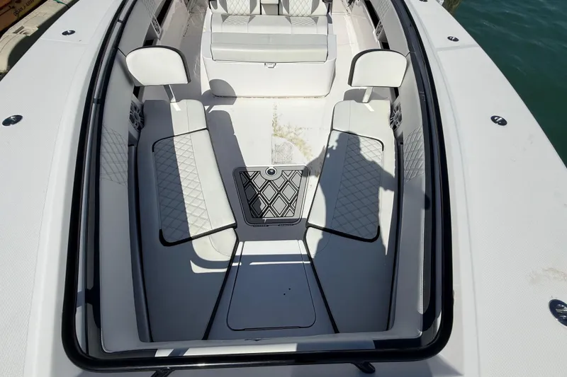 Slide: The Image of Front seating area of a 2020 Streamline 45 boat with white cushioned seats. - 63