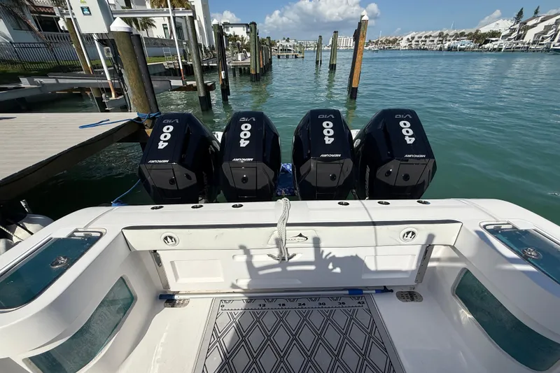 Slide: The Image of Streamline 45 boat with four Mercury 400 engines docked in a marina, 2020 model. - 69