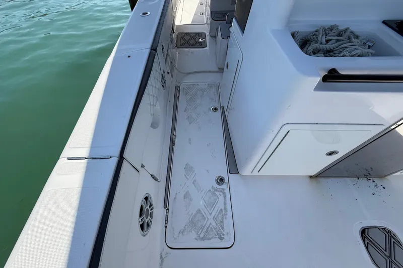 Slide: The Image of 2020 Streamline 45 boat deck with storage compartments and coiled rope. - 73