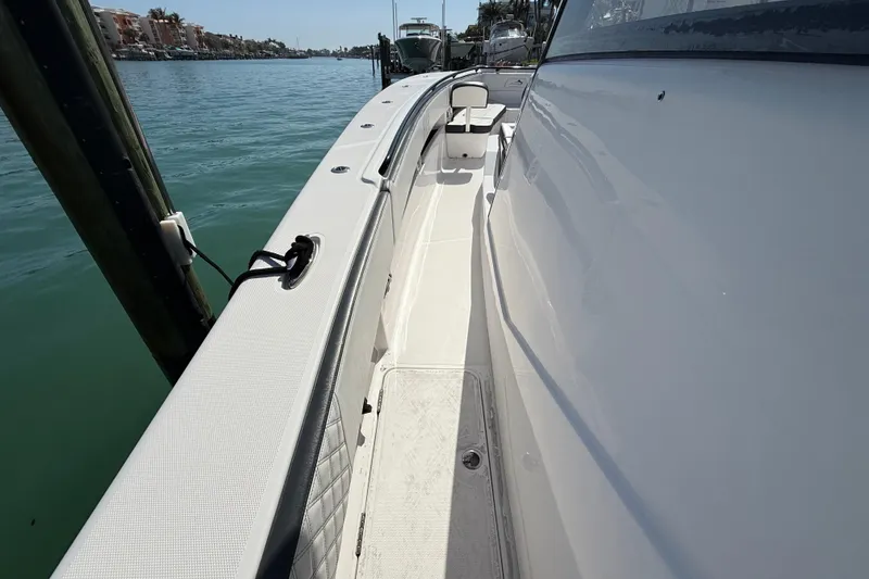 Slide: The Image of Side view of a 2020 Streamline 45 boat docked by the water. - 75