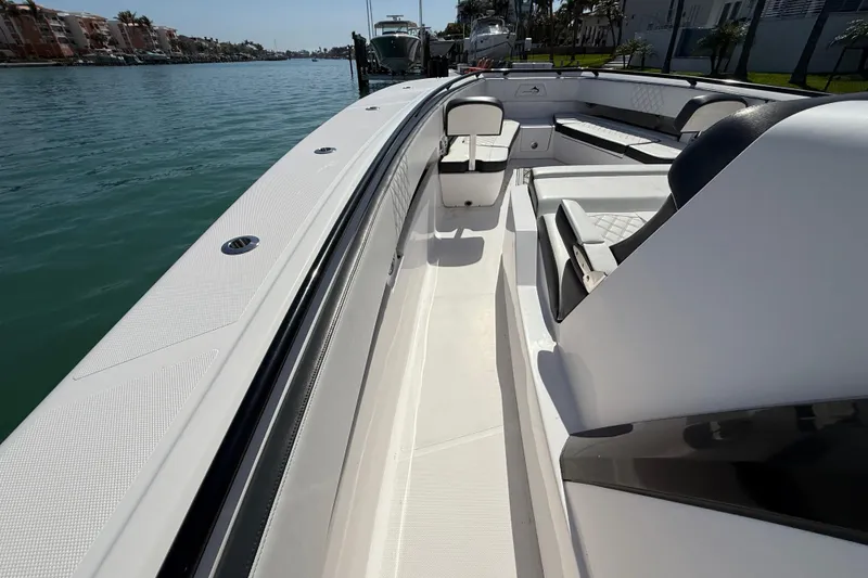 Slide: The Image of Streamline 45 boat, 2020 model, sleek design, spacious seating, docked by calm waters. - 78