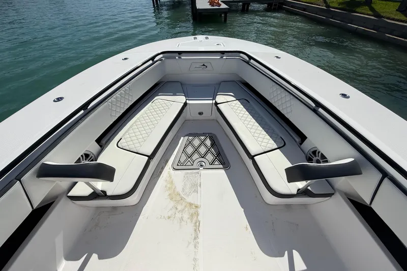 Slide: The Image of Luxurious seating area on a 2020 Streamline 45 boat, featuring elegant white upholstery. - 79