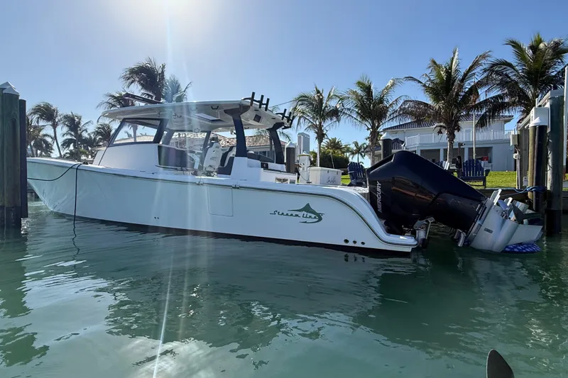 Slide: The Image of 2020 Streamline 45 boat docked in sunny marina with palm trees. - 8