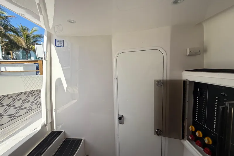 Slide: The Image of Interior of 2020 Streamline 45 boat with control panel and door, featuring modern design. - 86