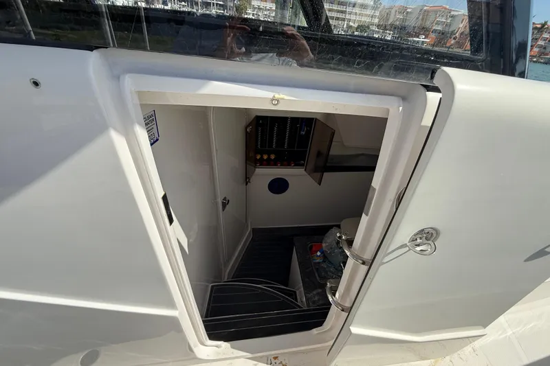 Slide: The Image of 2020 Streamline 45 boat cabin entrance with visible control panel and interior details. - 87