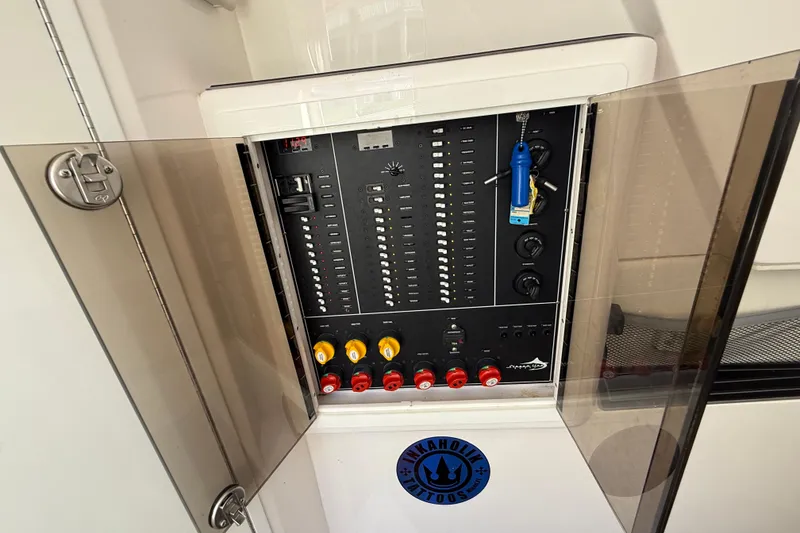 Slide: The Image of Electrical panel of a 2020 Streamline 45 boat with open glass doors. - 91