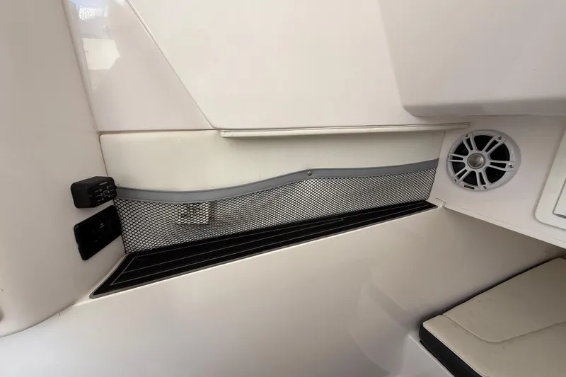 Slide: The Image of Interior of 2020 Streamline 45 boat with speaker and storage net. - 94