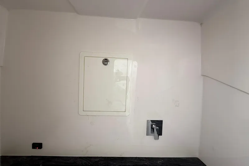 Slide: The Image of Interior of 2020 Streamline 45 with wall hatch and faucet. - 97