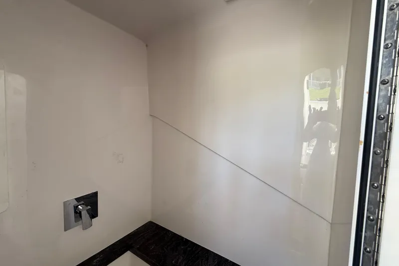 Slide: The Image of Interior of a 2020 Streamline 45, featuring a sleek, modern shower area. - 98