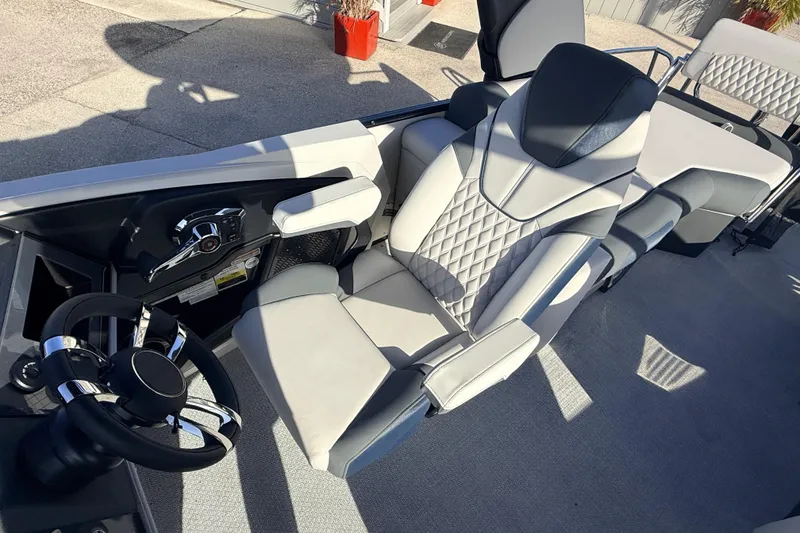 Slide: The Image of 2026 Avalon 2385 Catalina Quad Lounger interior with luxurious seating and modern steering wheel. - 17