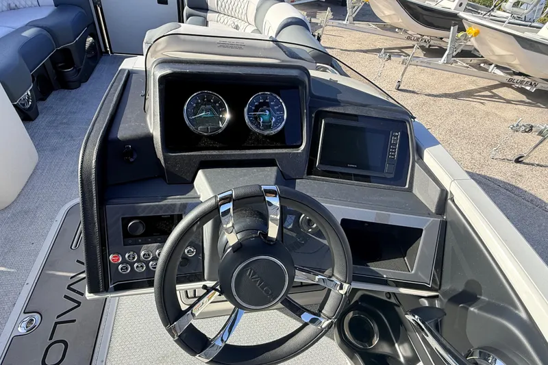 Slide: The Image of 2026 Avalon Catalina Quad Lounger dashboard with steering wheel and control panel. - 22