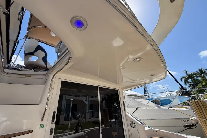 Slide: The Image of 1998 Sea Ray 400 Sedan Bridge yacht, featuring sleek design and modern amenities. - 15