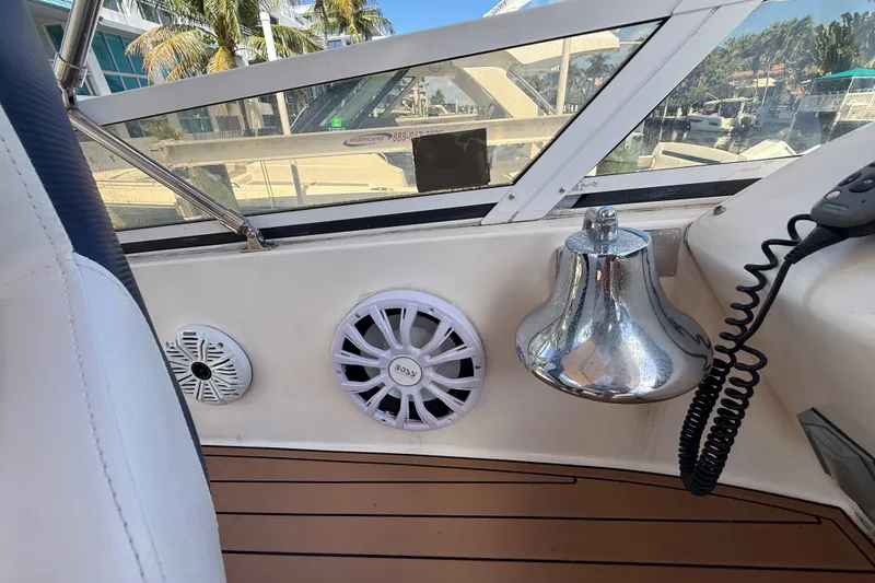 Slide: The Image of 1998 Sea Ray 400 Sedan Bridge interior with speakers and a chrome bell. - 18