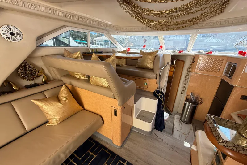 Slide: The Image of Luxurious interior of a 1998 Sea Ray 400 Sedan Bridge yacht with elegant decor. - 28