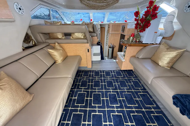 Slide: The Image of Luxurious interior of a 1998 Sea Ray 400 Sedan Bridge with elegant seating and decor. - 29