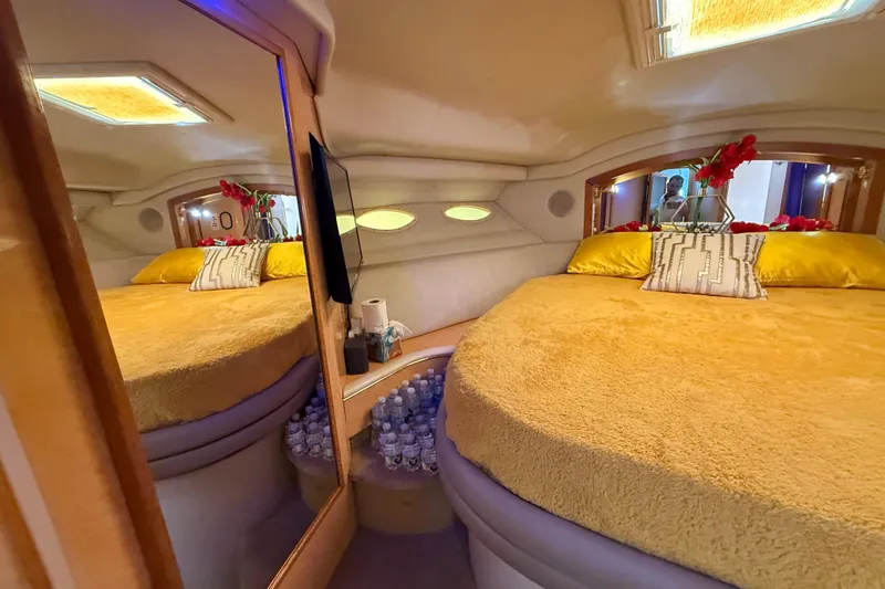 Slide: The Image of Luxurious 1998 Sea Ray 400 Sedan Bridge cabin with cozy bed and elegant decor. - 36