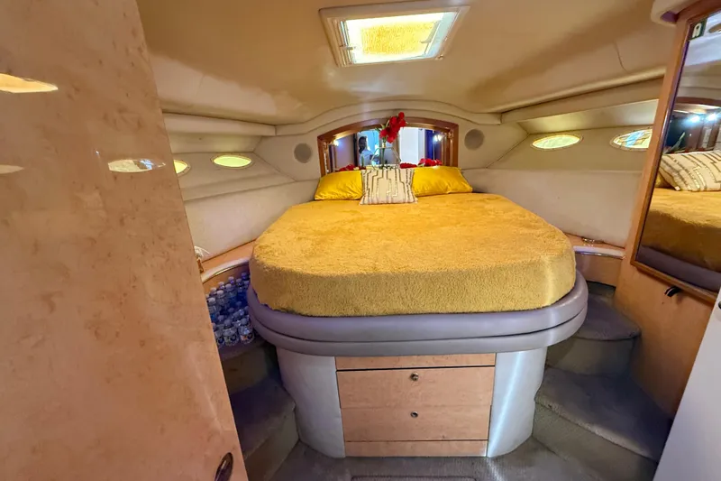 Slide: The Image of Luxurious 1998 Sea Ray 400 Sedan Bridge cabin with cozy bed and elegant decor. - 37