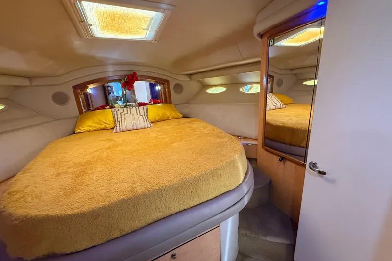 Slide: The Image of Luxurious 1998 Sea Ray 400 Sedan Bridge cabin with cozy bed and elegant decor. - 41