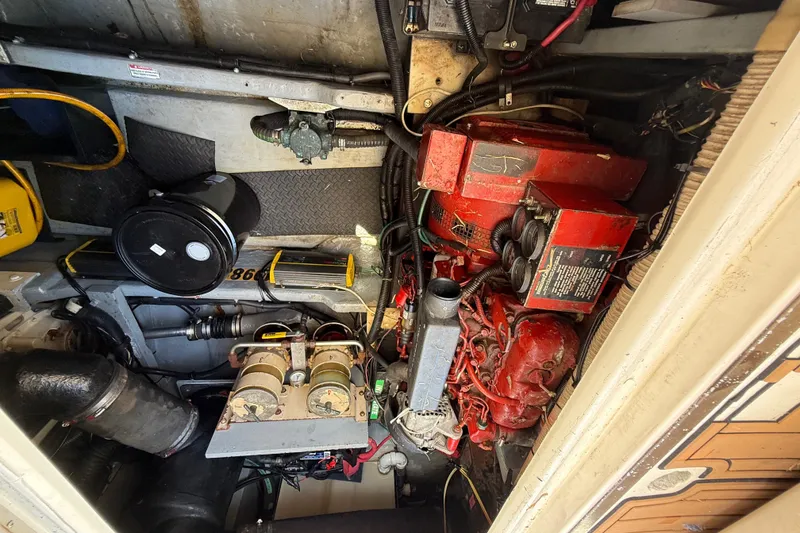 Slide: The Image of Engine room of a 1998 Sea Ray 400 Sedan Bridge with visible components and wiring. - 45