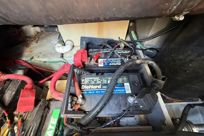 Slide: The Image of Battery compartment of a 1998 Sea Ray 400 Sedan Bridge with DieHard battery. - 49