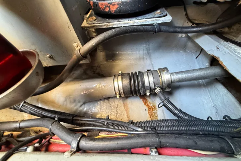 Slide: The Image of Engine compartment of 1998 Sea Ray 400 Sedan Bridge with visible hoses and wiring. - 51