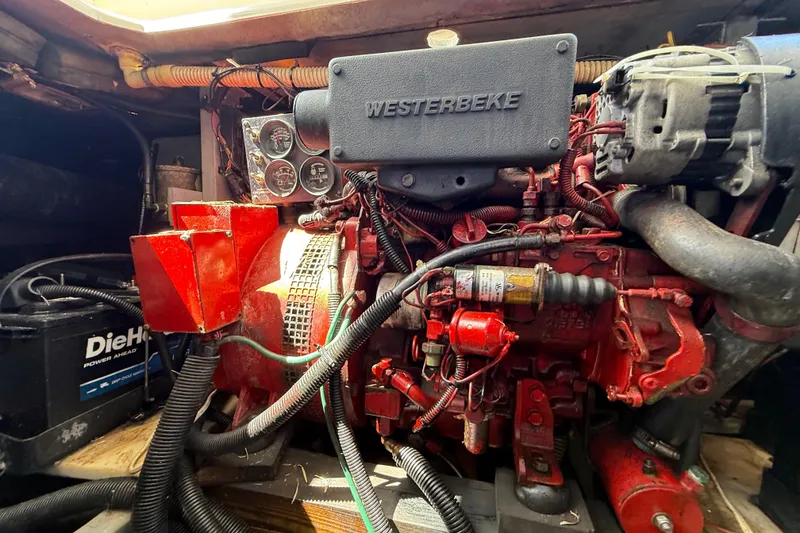 Slide: The Image of Engine compartment of a 1998 Sea Ray 400 Sedan Bridge with Westerbeke generator. - 53