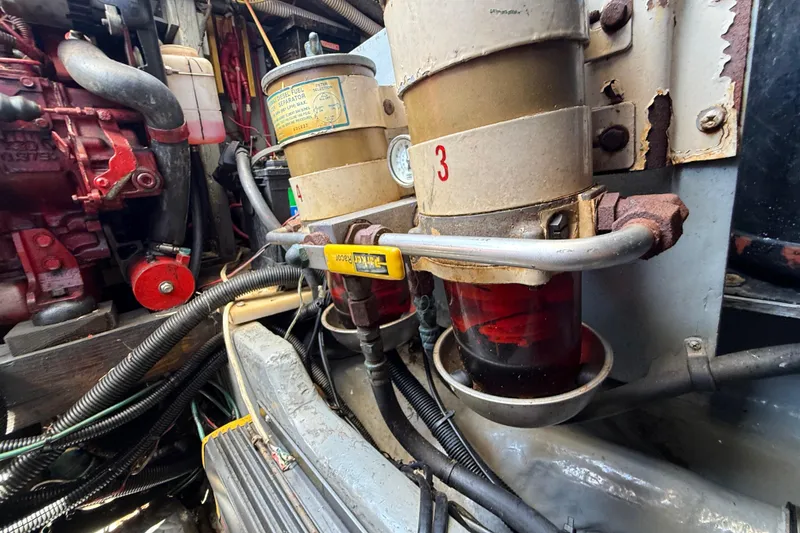 Slide: The Image of Engine room of 1998 Sea Ray 400 Sedan Bridge with fuel filter system. - 54