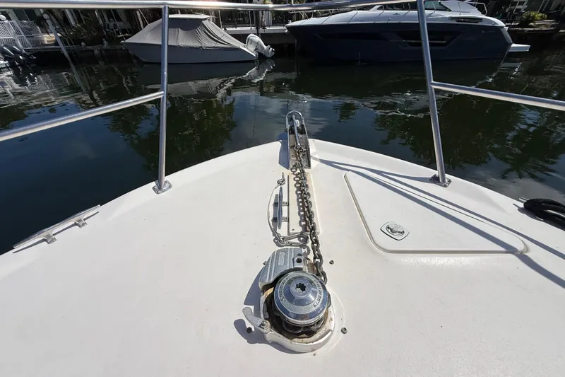 Slide: The Image of 1998 Sea Ray 400 Sedan Bridge bow with anchor chain and railing. - 7