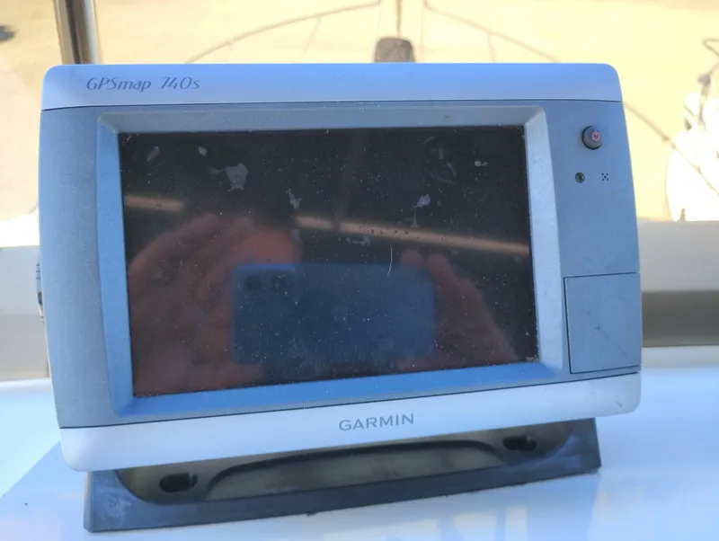 Slide: The Image of Garmin GPSmap 740s device on a 1978 Bertram 33 Convertible boat dashboard. - 15