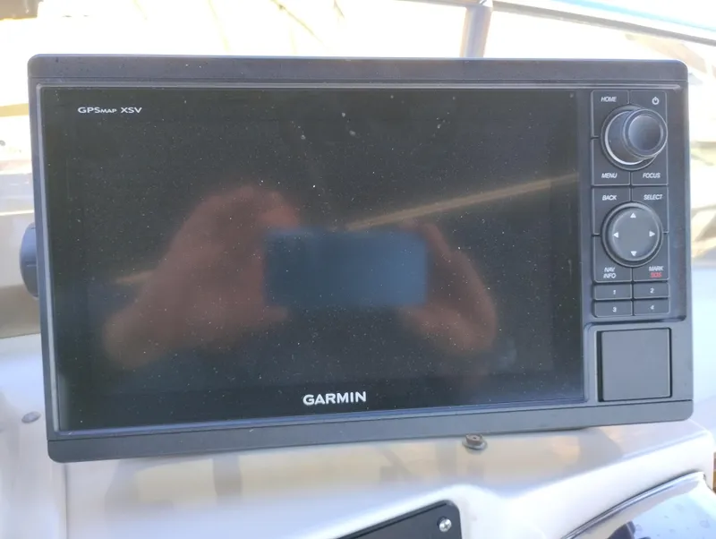 Slide: The Image of Garmin GPSmap XSV on 1978 Bertram 33 Convertible boat dashboard. - 16
