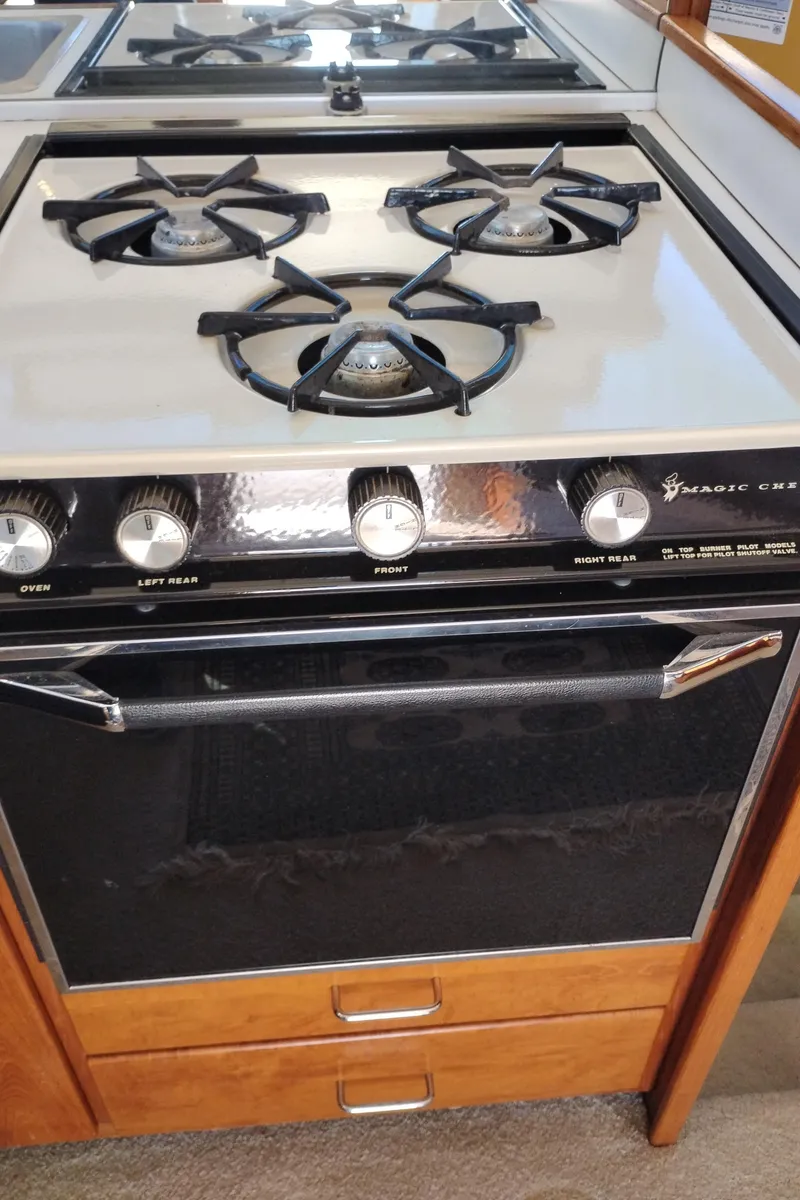 Slide: The Image of Vintage Magic Chef stove with four burners on a 1978 Bertram 33 Convertible yacht. - 26