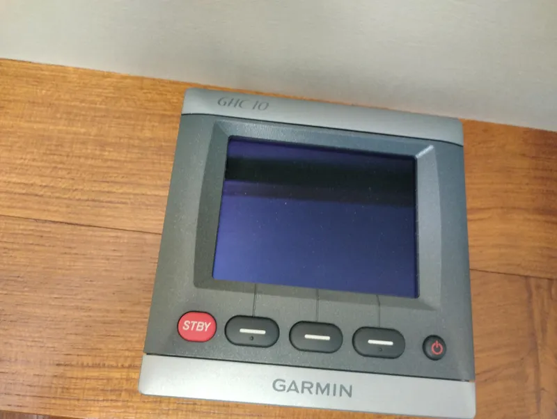 Slide: The Image of Garmin GHC 10 marine display on a 1978 Bertram 33 Convertible boat. - 31
