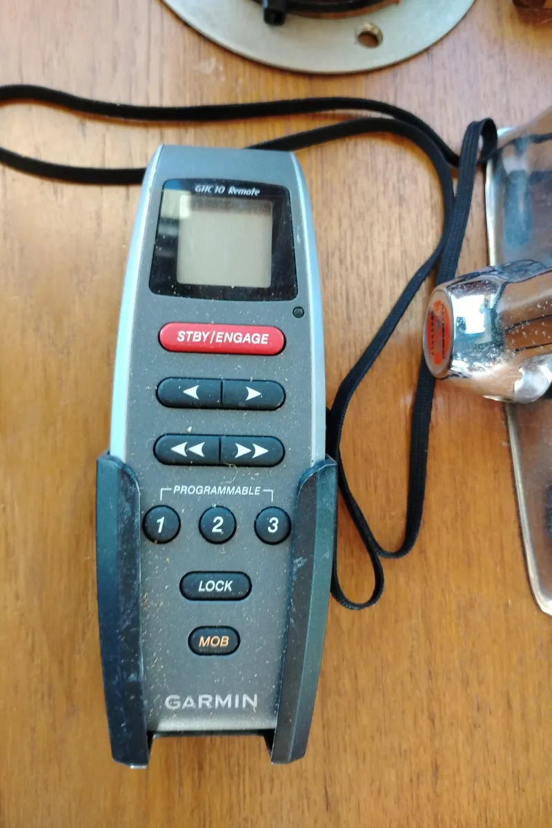 Slide: The Image of Garmin GHC 10 remote on a 1978 Bertram 33 Convertible boat. - 32