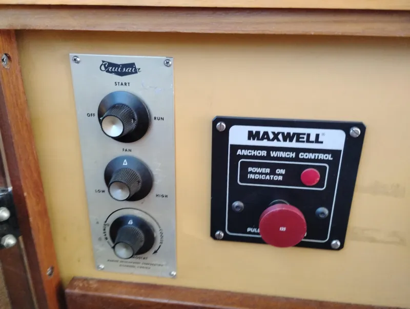 Slide: The Image of Control panel of a 1978 Bertram 33 Convertible boat with Cruisair and Maxwell systems. - 35