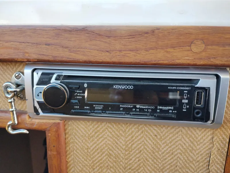 Slide: The Image of Kenwood stereo system in a 1978 Bertram 33 Convertible boat interior. - 37