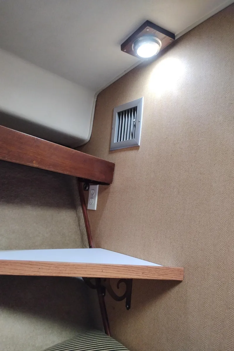 Slide: The Image of Interior of 1978 Bertram 33 Convertible with shelf, light, and vent. - 44