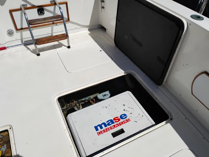Slide: The Image of 1978 Bertram 33 Convertible boat deck with Mase generator and ladder. - 6