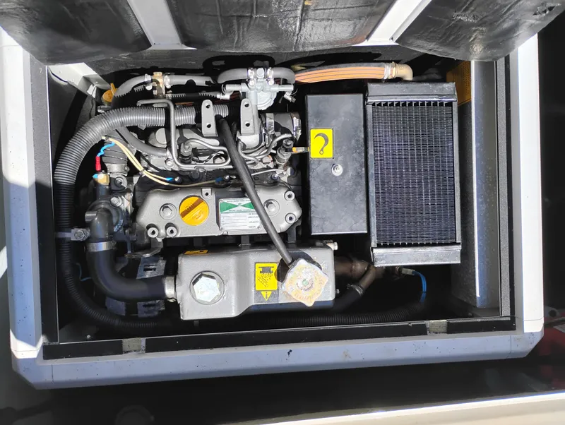 Slide: The Image of Engine compartment of a 1978 Bertram 33 Convertible boat, showcasing mechanical components. - 8