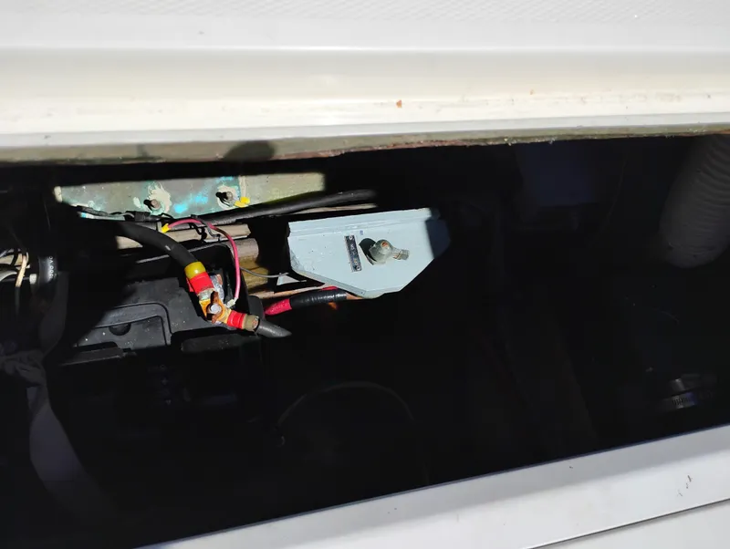 Slide: The Image of Engine compartment of a 1978 Bertram 33 Convertible boat, showing wiring and components. - 9