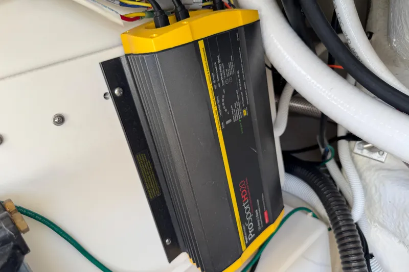 Slide: The Image of Battery charger in a 2022 Robalo 266 Cayman boat, featuring ProSportHD20 model. - 101