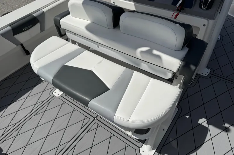 Slide: The Image of 2022 Robalo 266 Cayman boat seating with gray and white upholstery. - 109