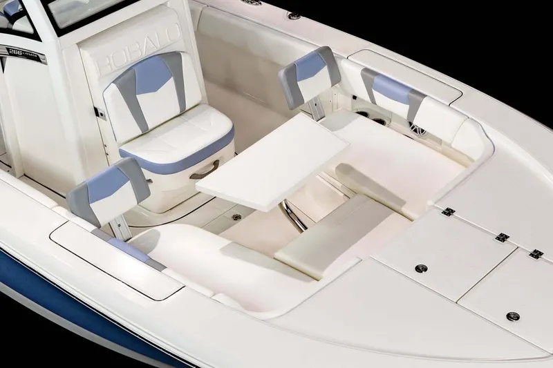 Slide: The Image of 2022 Robalo 266 Cayman boat hull on trailer, reflecting surroundings. - 11