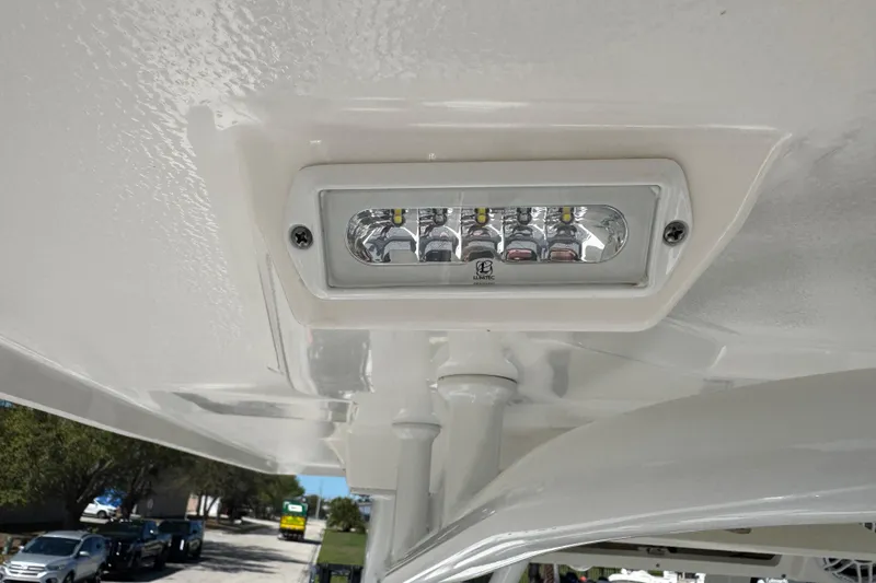 Slide: The Image of LED light fixture on 2022 Robalo 266 Cayman boat ceiling. - 112