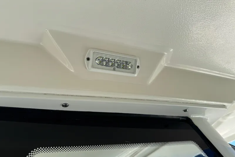 Slide: The Image of LED light fixture on 2022 Robalo 266 Cayman boat ceiling. - 114