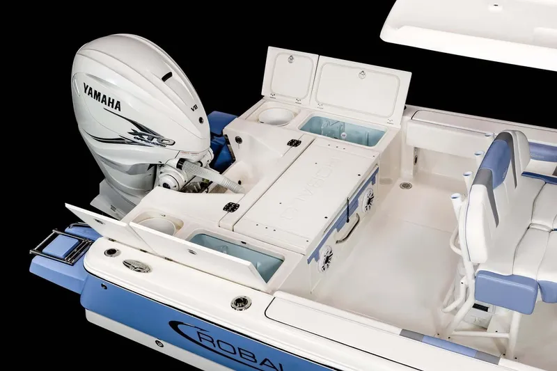 Slide: The Image of 2022 Robalo 266 Cayman boat side view on trailer, showcasing sleek design. - 16
