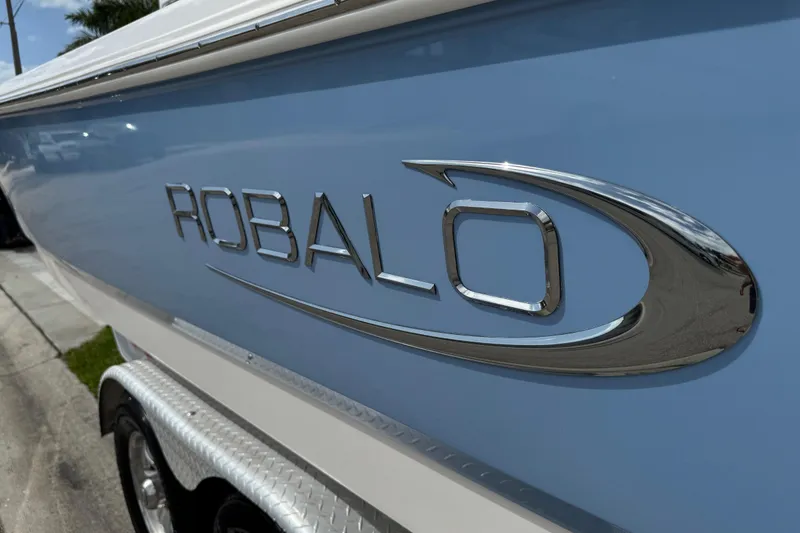 Slide: The Image of Close-up of a shiny metal boat propeller for a 2022 Robalo 266 Cayman. - 24