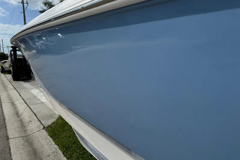 Slide: The Image of Close-up of 2022 Robalo 266 Cayman boat engine detail. - 25