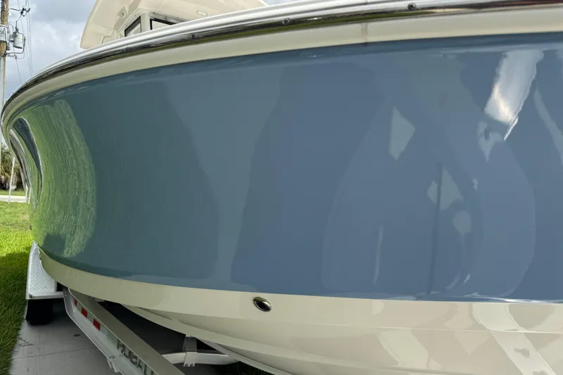 Slide: The Image of Close-up of 425 V8 5.6L engine on 2022 Robalo 266 Cayman boat. - 27