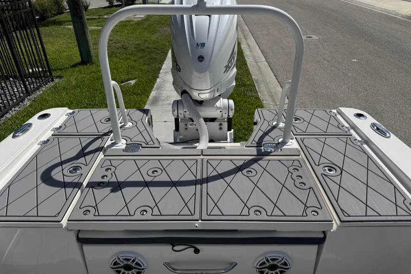 Slide: The Image of 2022 Robalo 266 Cayman boat deck with motor, featuring sleek design and modern fittings. - 38