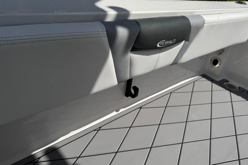Slide: The Image of 2022 Robalo 266 Cayman boat interior with branded upholstery and deck flooring. - 39